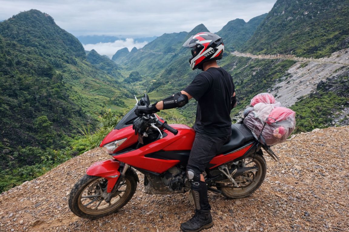 Motorbike touring the Ha Giang Loop with panoramic mountain views