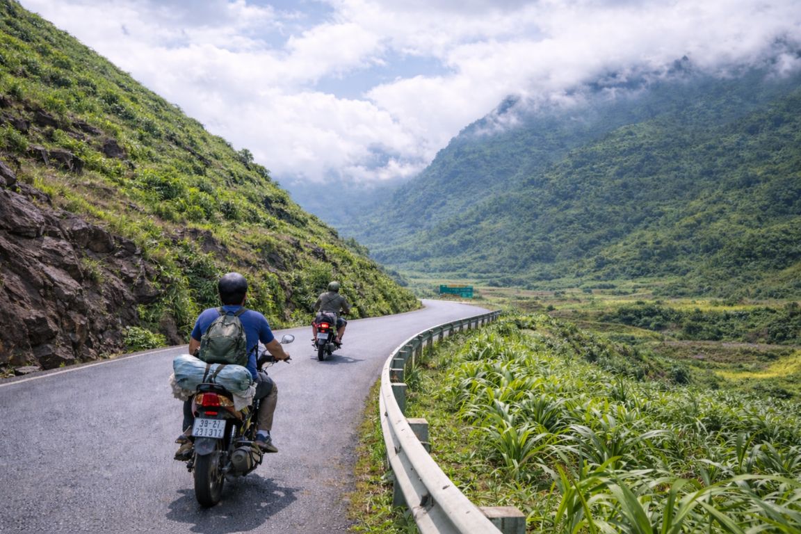 Scenic Ha Giang mountain road ride captured during a multi-day motorbike tour with Ha Giang Tours in northern Vietnam.