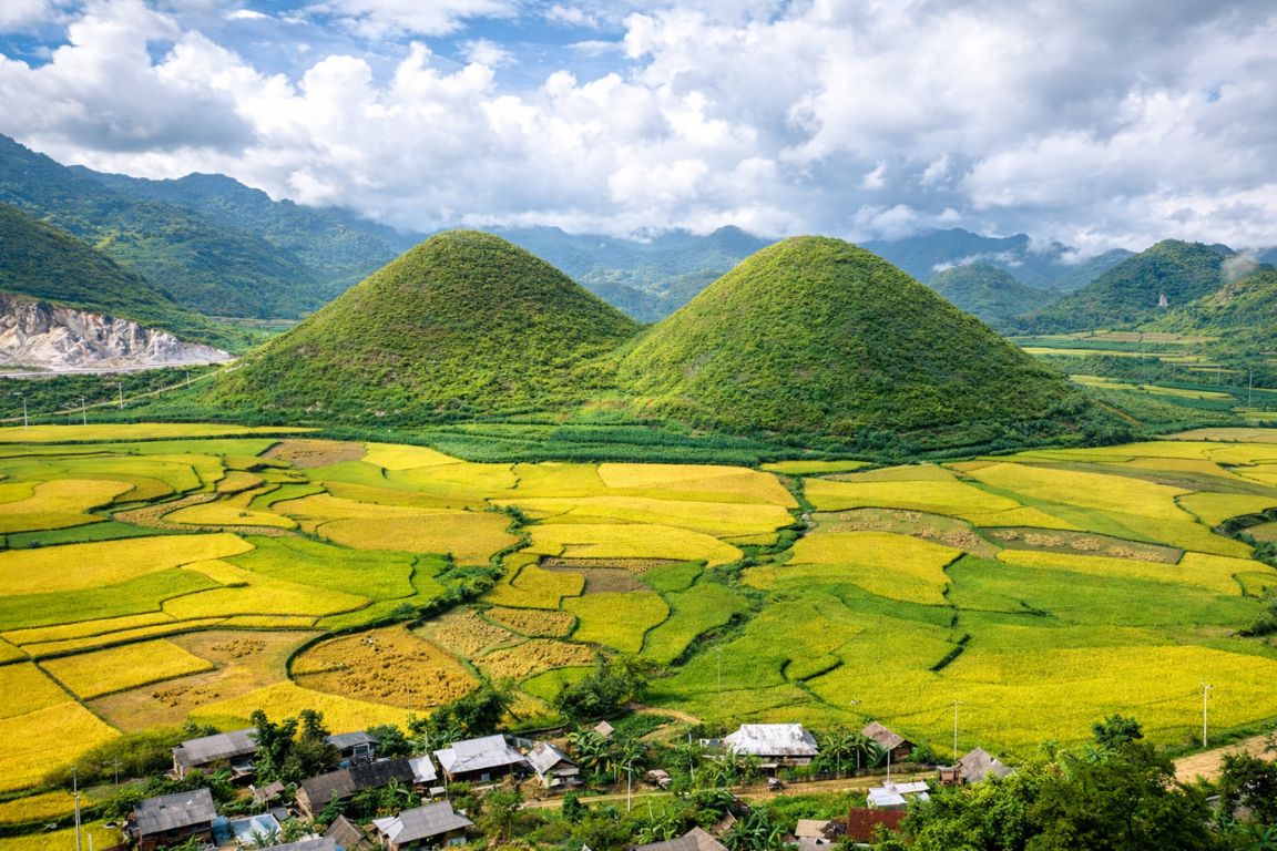 Fairy Breast Mountains at Heaven’s Gate Quan Ba overlooking golden rice fields and villages